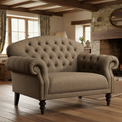 Tetrad Arbroath Snuggler Sofa in Jura Stag Harris Tweed upholstery with deep button tufting, scrolled armrests with stud detailing, and dark wooden legs