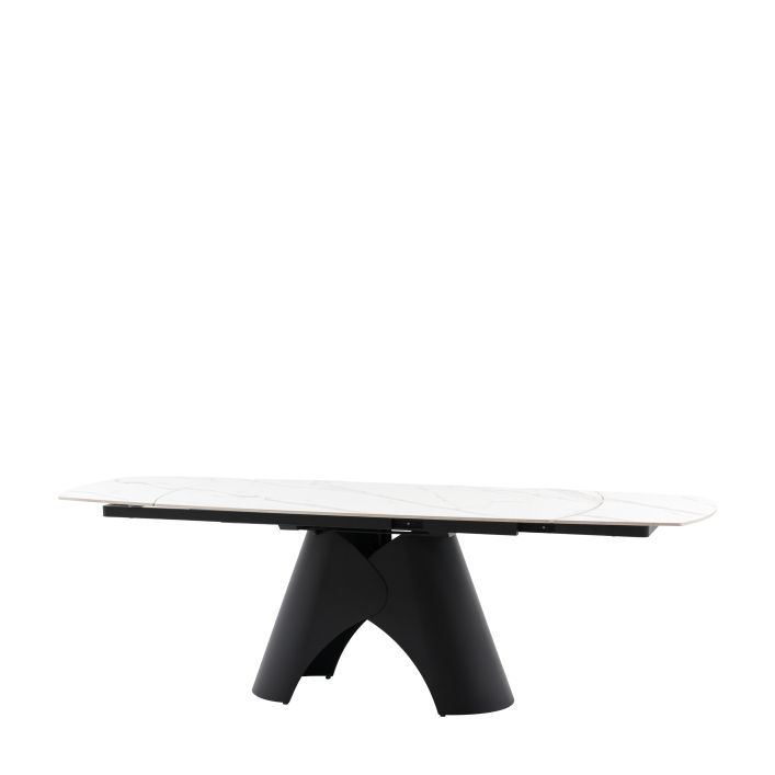 Gallery Direct Bresso Extending Dining Table with a matt black metal base and a Carrara marble style ceramic table top