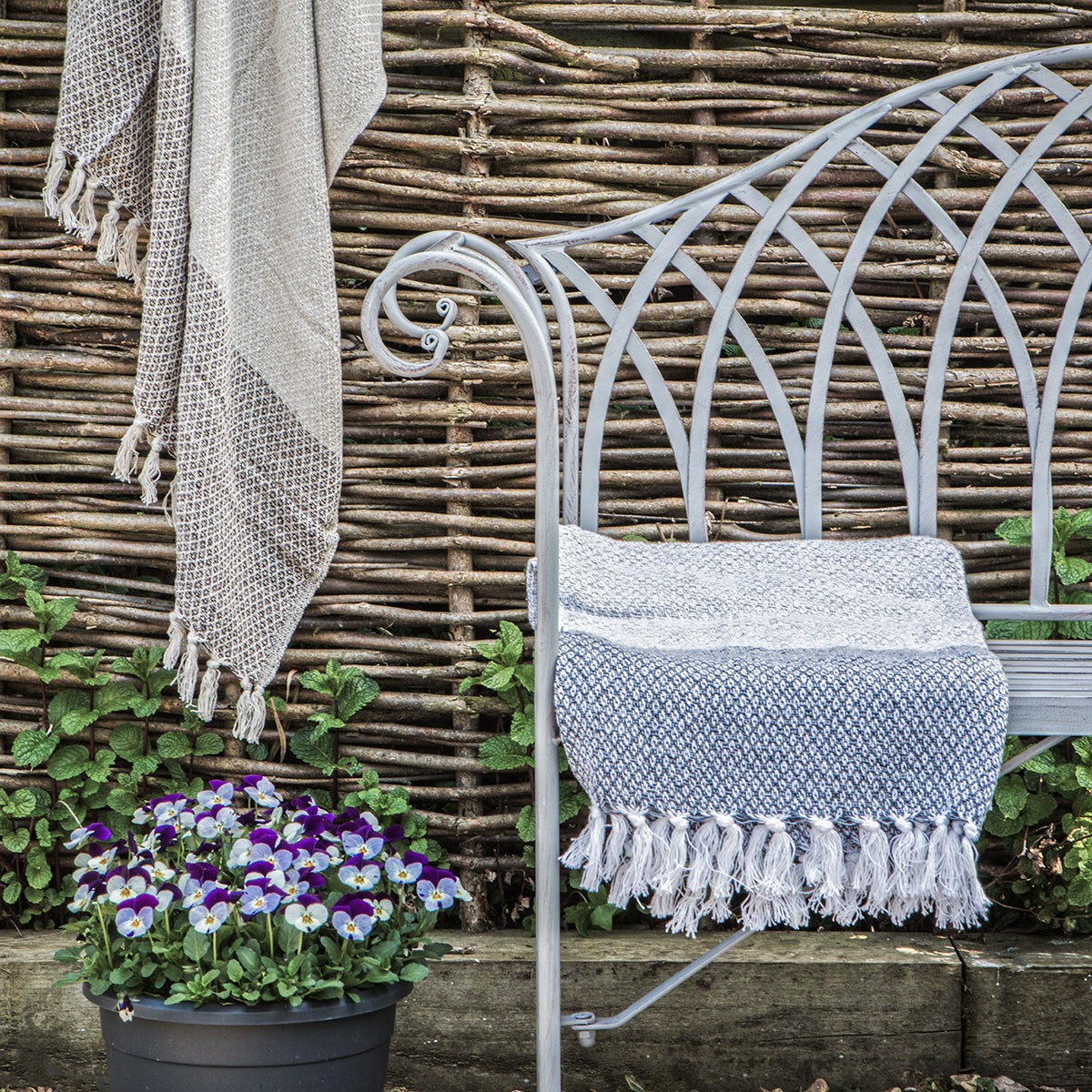 Gallery Garden Duchess Bench in a Distressed Grey metal frame with scroll style arms and curved back design