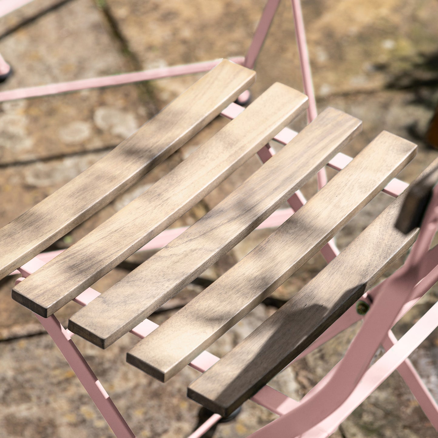 Gallery Garden Ronda Bistro Set with a Pink coloured metal frame and acacia wood slatted seat
