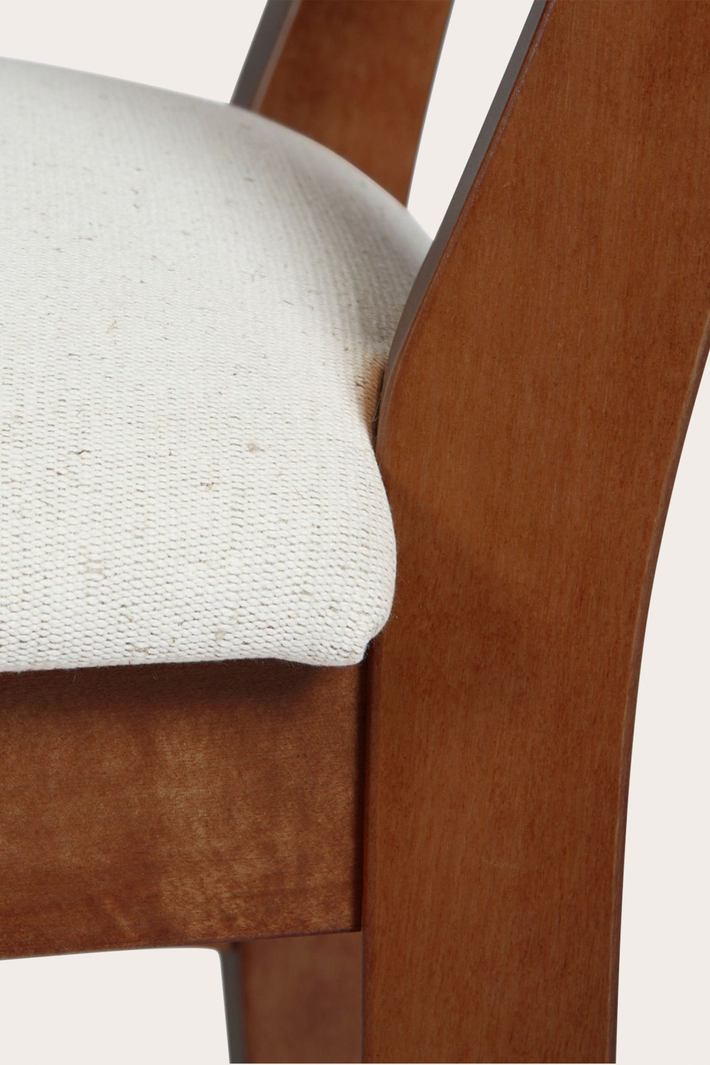 Pair of Laura Ashley Balmoral wooden dining chairs featuring deep chestnut birch finish, cross-back detail and cushioned cream seats.