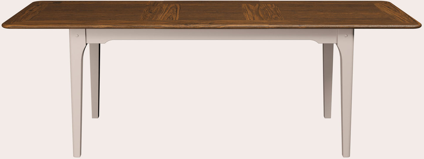 Hapton extending dining table from Laura Ashley with Soft Truffle painted legs and Dark Chestnut stained wood top, designed in a contemporary Shaker style.