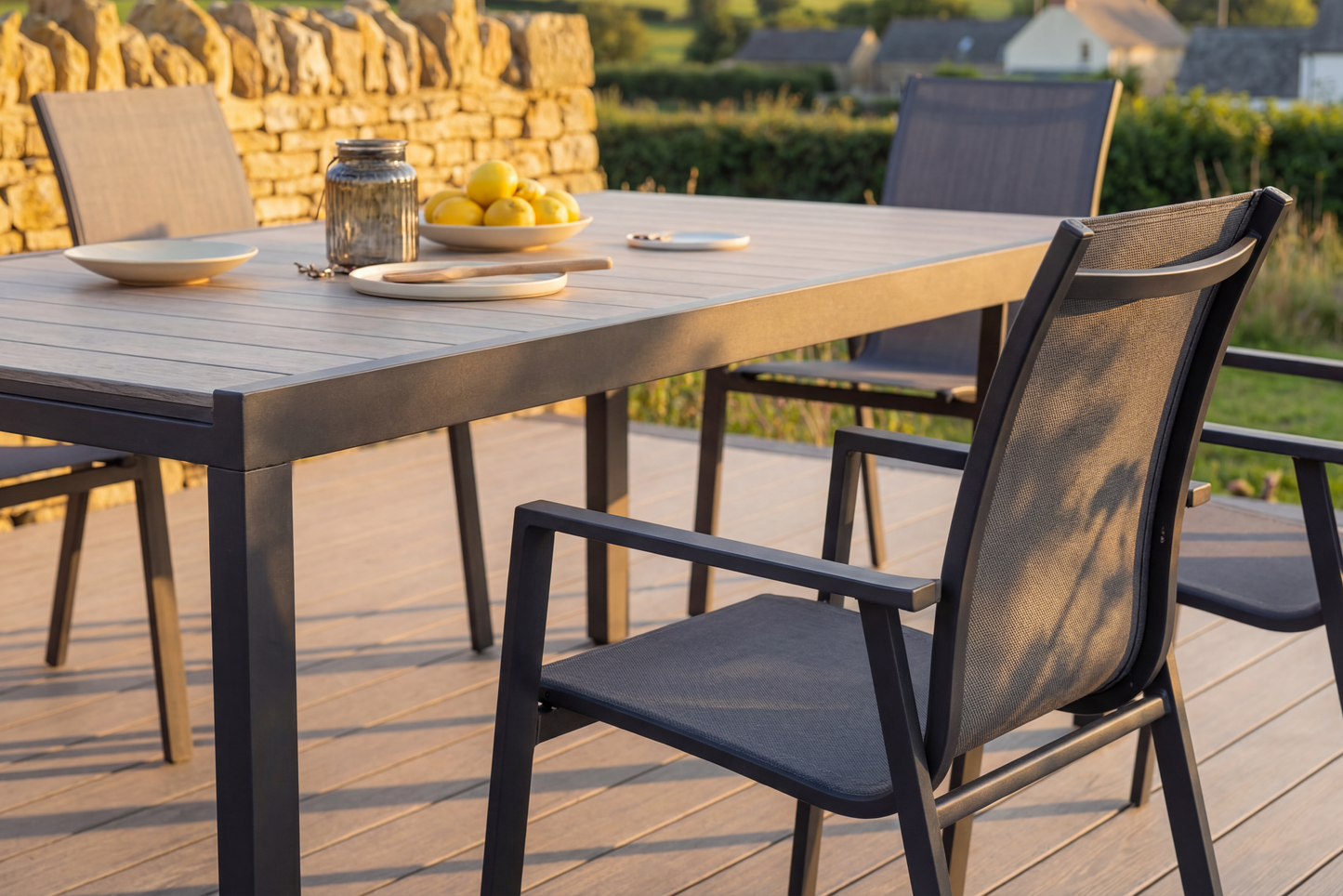 Royal Garden Catala 6 Seat Mixed Dining Set features a rectangular dining table with aluminium frame and a wood-effect grooved table top, plus six stylish aluminium stacking chairs with textilene fabric seats.