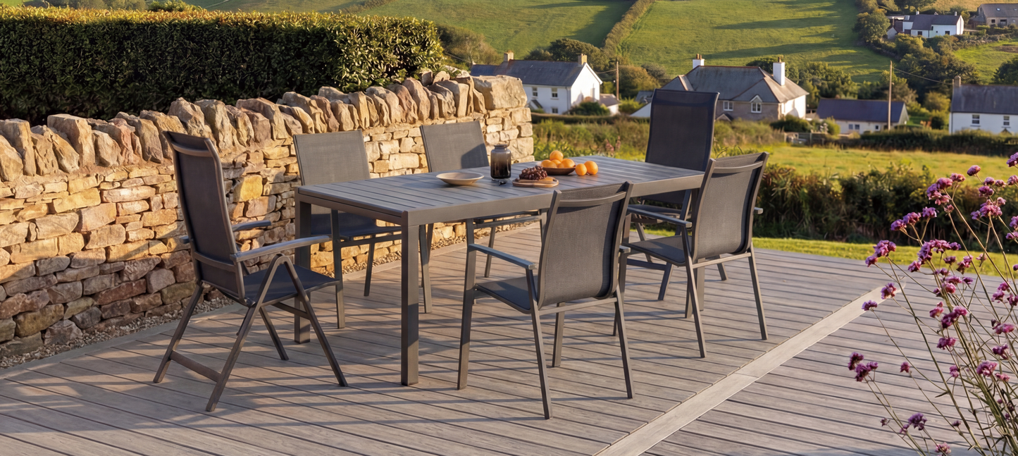 Royal Garden Catala 6 Seat Mixed Dining Set features a rectangular dining table with 4 stackable chairs and 2 reclining chairs in a charcoal grey colour finish