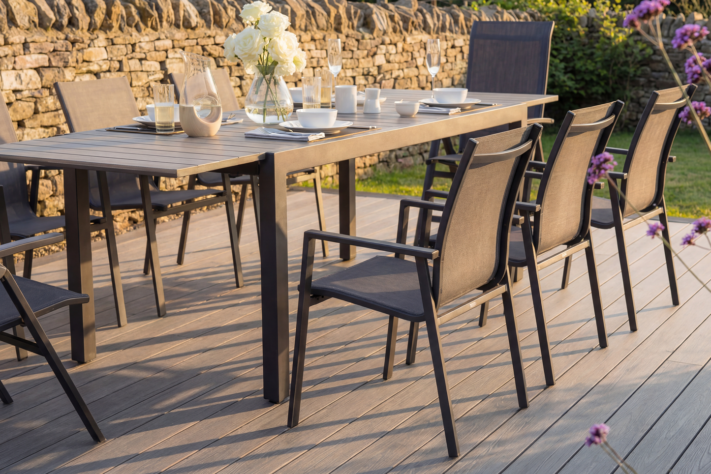 The Royal Garden Catala Extending Dining Set features a mix of 8 chairs, 2 reclining and 6 stacking, plus an extending table with a grooved wood effect table top