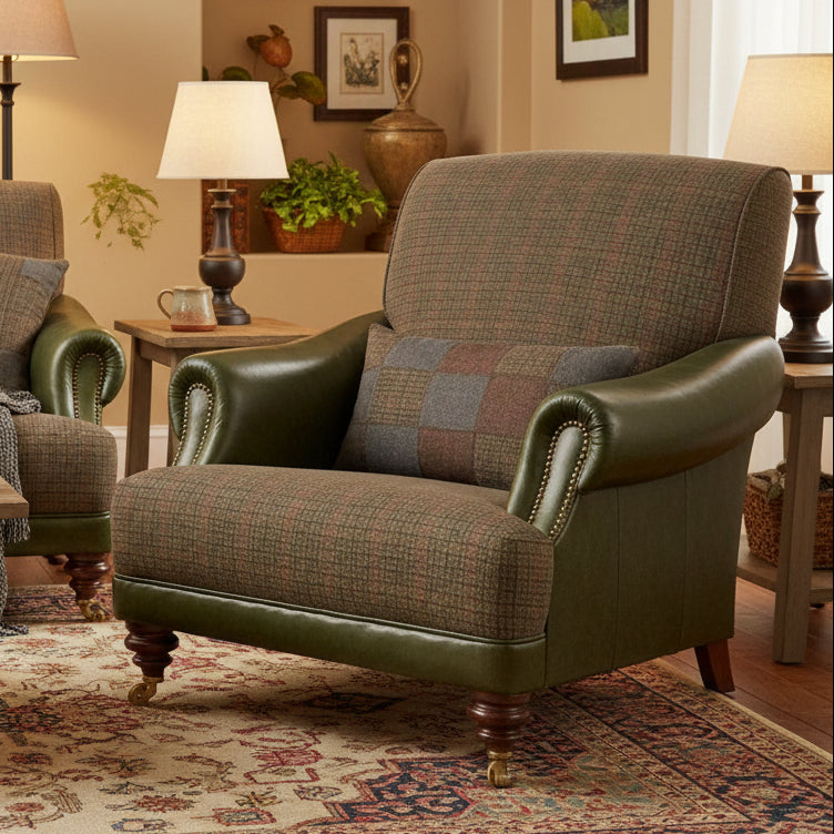 Tetrad Taransay Gentleman's Chair in a neutral tone mixed fabric and rich olive green leather, with dark wooden legs and front castors