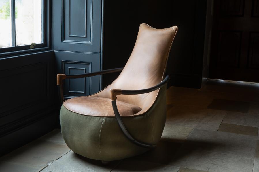 Vintage Sofa Company Apache Chair in Washed Green Canvas and Tan Leather upholstery, with an exposed metal frame