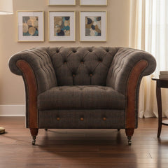 Vintage Sofa Company Chester Club Chair in Moreland Harris Tweed Fabric with tan leather scrolled arms, deep button tufting and a generous seat. It brings heritage texture, comfort and lasting character to a room without feeling overly formal.