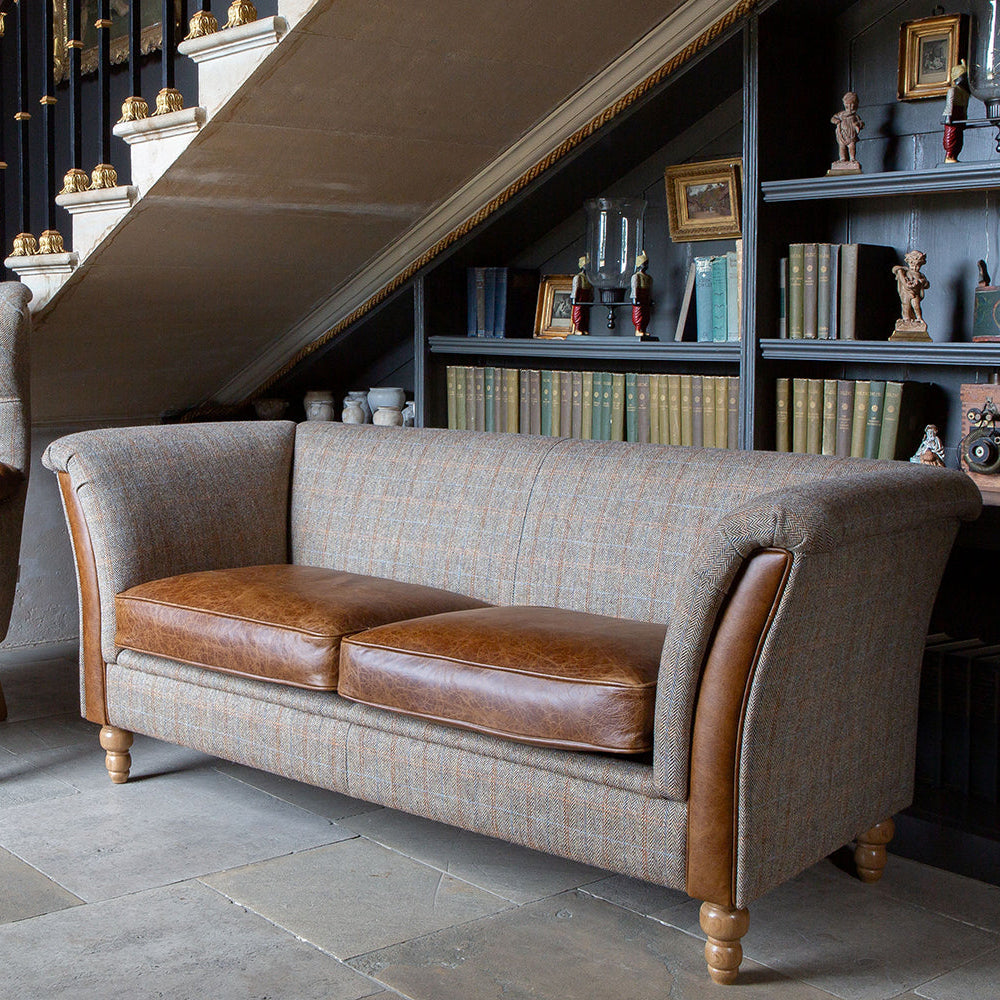 Vintage Sofa Company Granby 3 Seater Plain Back Sofa with warm tan leather seat cushions and arm panels, and turned wooden legs