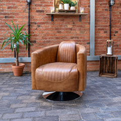 Vintage Sofa Company Spitfire Rocket Swivel Armchair shown in a room setting