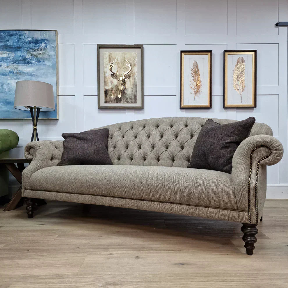 Traditional sofa with rolled arms in a styled living room setting