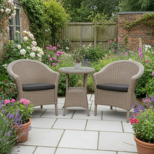 4 Seasons Outdoor Chester Penida Bistro Set in Pure Weave material, features 2 armchairs with seat pads and a glass top bistro table with a lower shelf