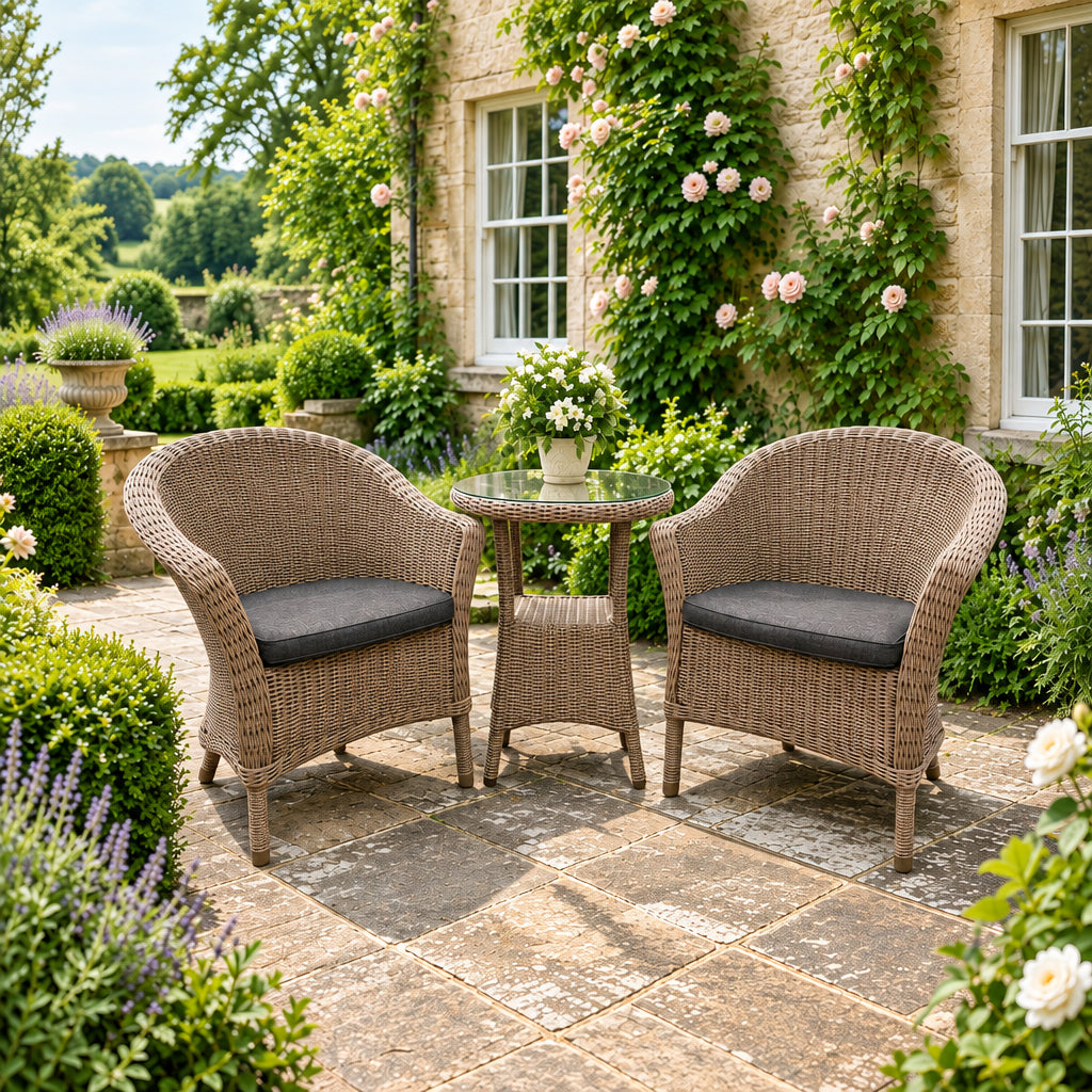 4 Seasons Outdoor Chester Penida Bistro Set in Pure Weave material has a glass top bistro table with lower shelf and 2 armchairs with seat pads