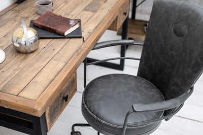 Baker Carter Office swivel chair with adjustable height, upholstered in a dark grey faux leather with metal frame and legs with castor wheels