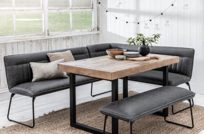The Baker Cooper 2 seater Low Bench in Grey faux leather padded upholstery, with black metal tubular legs