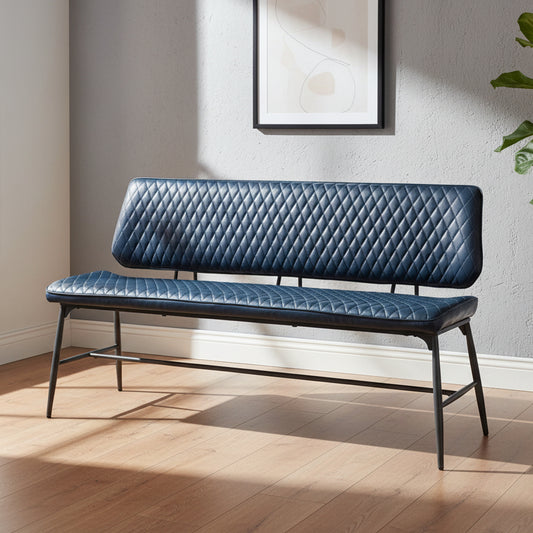 The Baker Dalton Bench in Dark Blue quilted padded faux leather upholstery, with black metal legs 