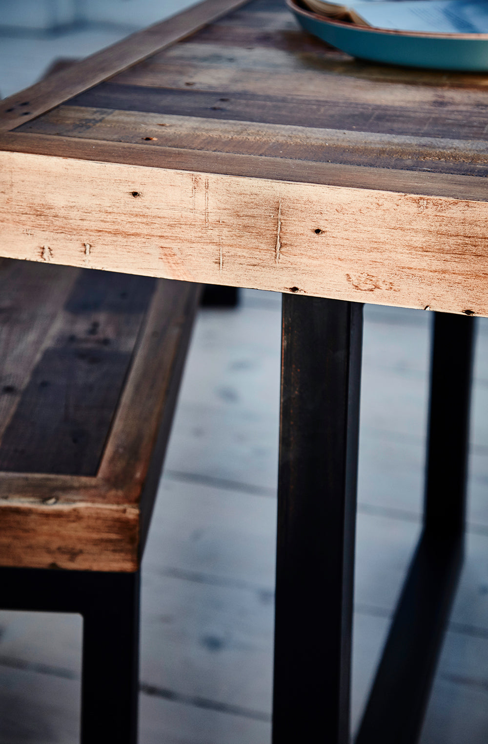 Baker Nixon 180cm Dining Table features natural reclaimed timber and powder coated anthracite aluminium legs