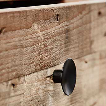 Baker Nixon Desk is constructed from natural reclaimed woods with black metal hardware for a rustic, industrial look