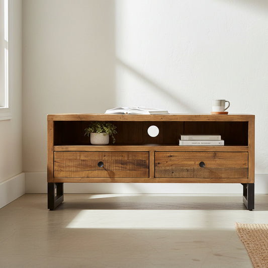 Baker Nixon Small TV Cabinet features 2 storage drawers and a media shelf with cable access. Made from reclaimed woods with metal legs for a rustic industrial look and feel