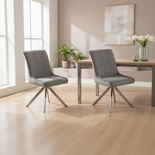 Baker Pair of Chloe Dining Chairs upholstered in a padded Grey Velvet fabric with sleek chrome legs