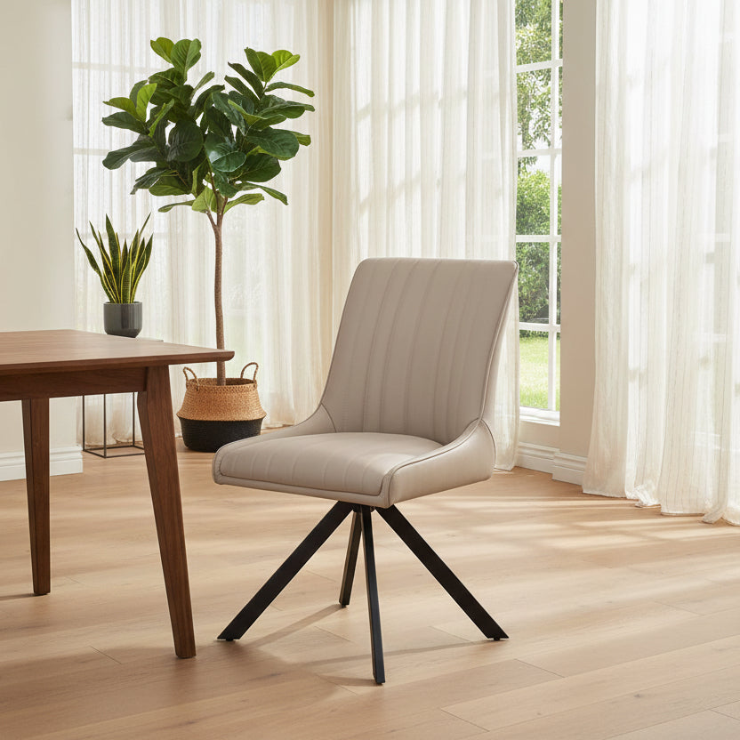 Baker Pair of Chloe Dining Chairs in a Taupe coloured faux leather upholstery with black powder coated aluminium legs
