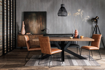 The Baker Cooper pair of Dining Chairs upholstered in Tan faux leather fabric with black powder coated legs