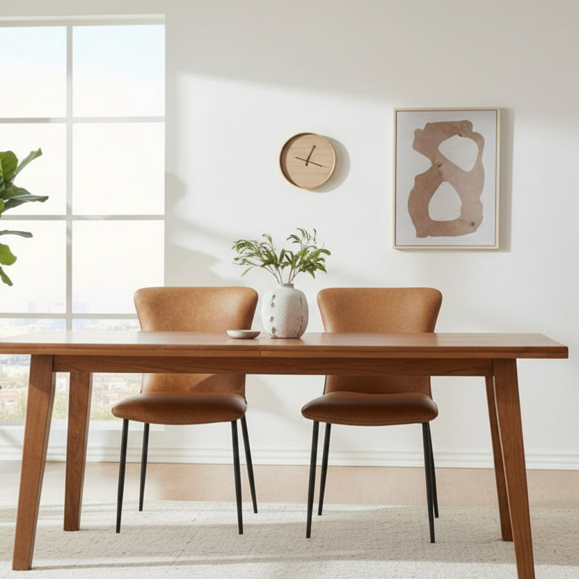 Baker Pair of Ella Dining Chairs in tan faux leather padded upholstery with black powder coated aluminium legs