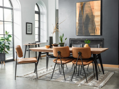 The Baker Pair of Jack Dining Chairs upholstered in a Cognac Tan coloured faux leather material with black powder coated metal legs