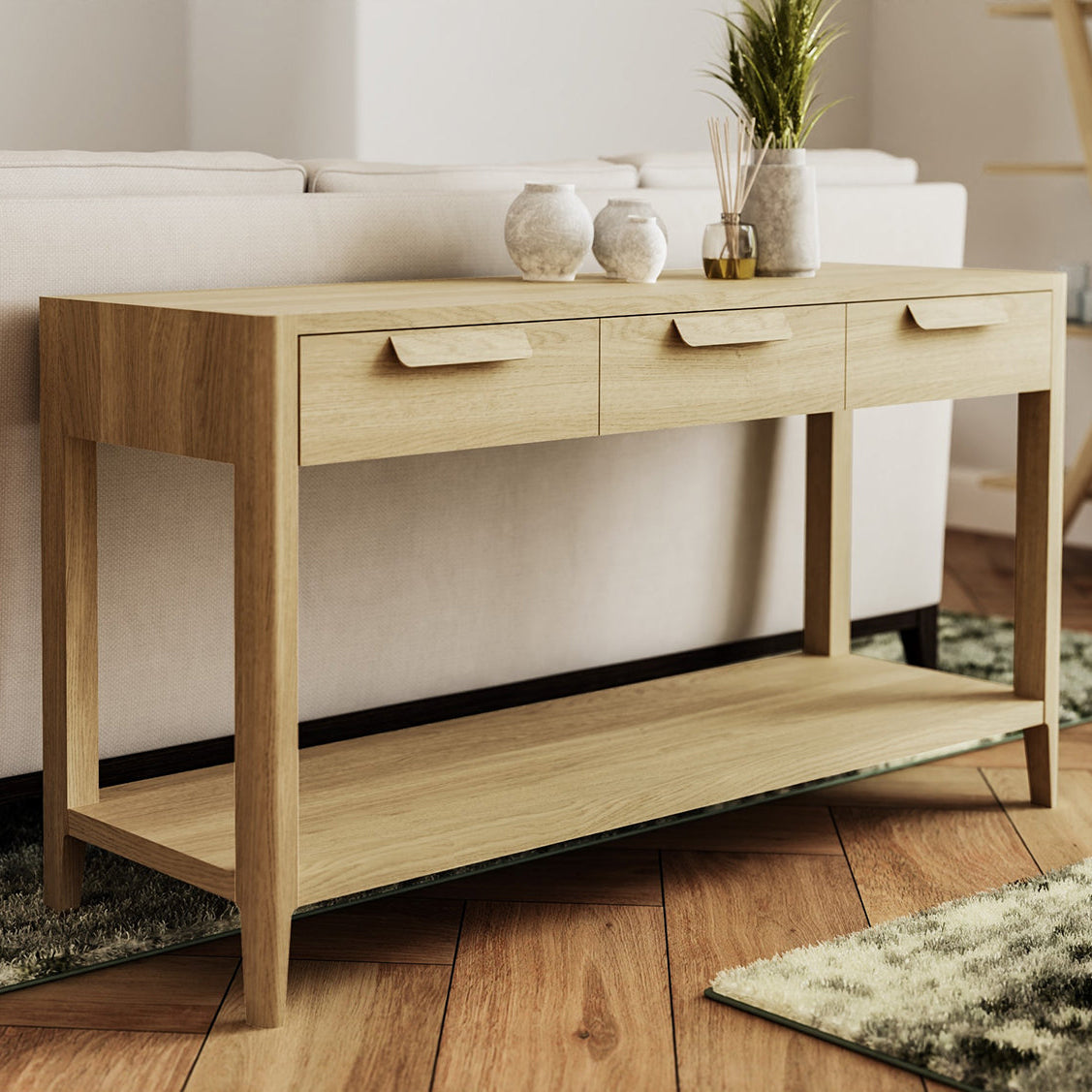 Carlton Furniture Andersson Console Table with 3 Drawers and lower shelf in a natural oak wood with a modern feel