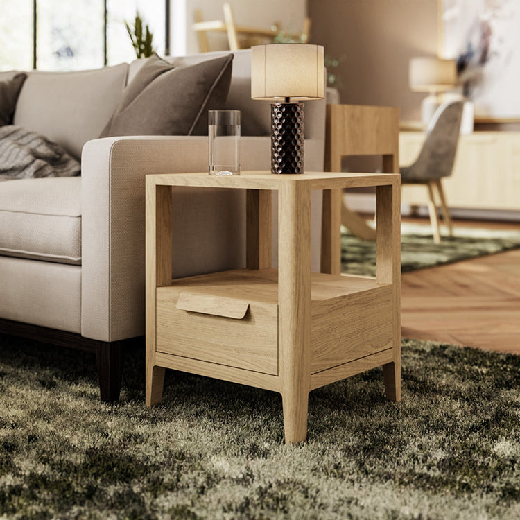 Carlton Furniture Andersson Lamp Table with 1 storage drawer and a shelf in a natural solid oak wood