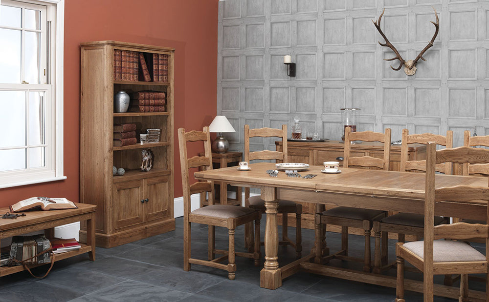 The Copeland 1400 Extending solid Oak Dining Table from Carlton Furniture, can seat 4-6 people and has pedestal legs 