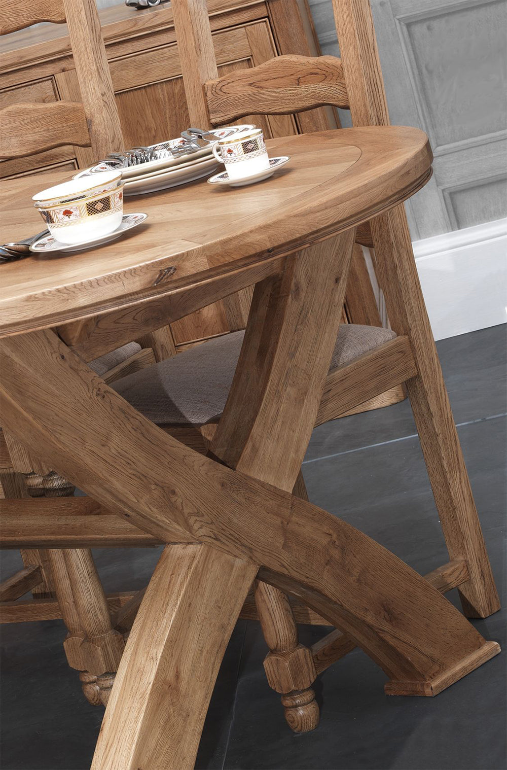 Carlton Furniture Copeland 1800 Cross Leg Oval Extending Dining Table features chunky solid oak wood cross legs and oval table top