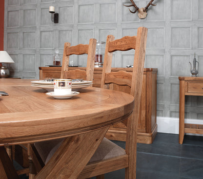 Carlton Furniture Copeland 1800 Cross Leg Oval Extending Dining Table features a chunky solid oak oval table top that can accommodate 8-12 people when extended