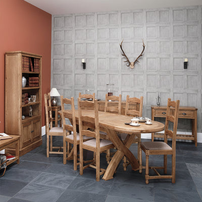 The Carlton Furniture Copeland 1800 Dining Table features a Cross Leg design, the oval table top extends to accommodate 8-12 people comfortably