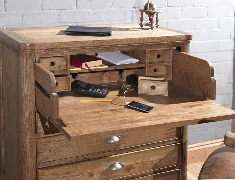 Carlton Furniture Copeland Oak Chest Desk with hidden fold down writing surface, multiple storage compartments and versatile drawer space underneath