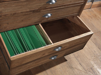 The Carlton Furniture Copeland Chest Desk is a versatile piece of furniture constructed from premium oak with multiple drawers with traditional cup handles