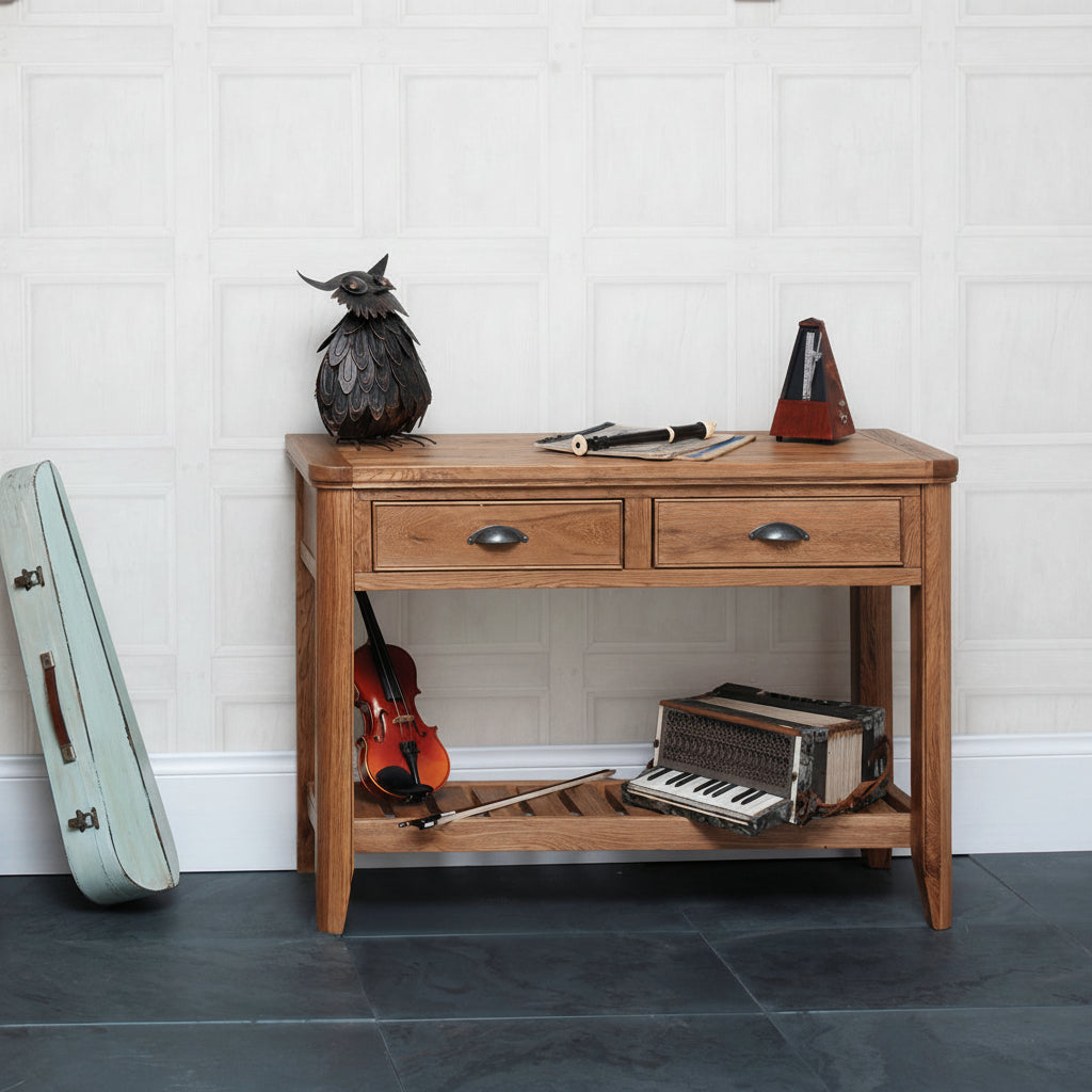 Carlton Furniture Copeland Console Table features 2 drawers with metal handles and a lower storage shelf, constructed from natural solid oak wood