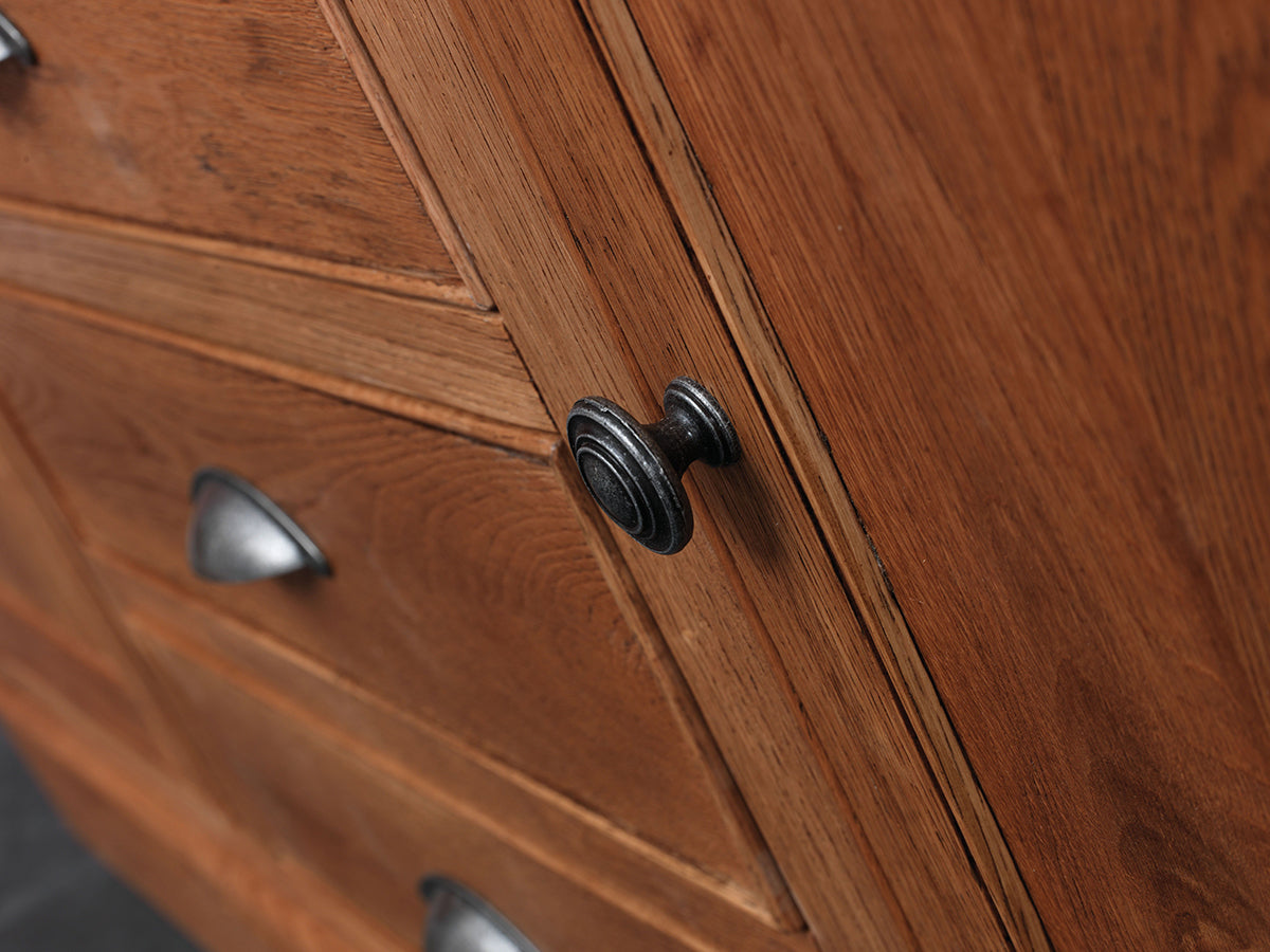 Carlton Furniture Copeland Large Sideboard is made from solid oak wood, with metal door knobs and cup handles to the drawers