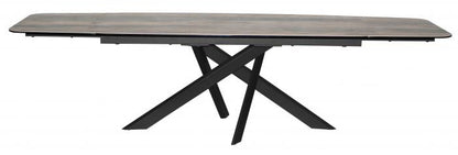 Carlton Furniture Florence Extending Oval Dining Table with ceramic table top and black metal spider leg base