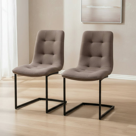 Carlton Furniture Pair of Hampton Dining Chairs Upholstery in a Tawny coloured Fabric with button tufting and black cantilever base