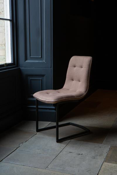 Carlton Furniture Hampton Dining Chairs Upholstered in a Tawny Coloured Fabric with button tufting and black cantilever legs