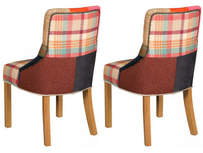 Carlton Furniture Pair of Stanton Chairs upholstered in a colourful Patchwork material with brass stud detailing to the back, and natural wooden legs