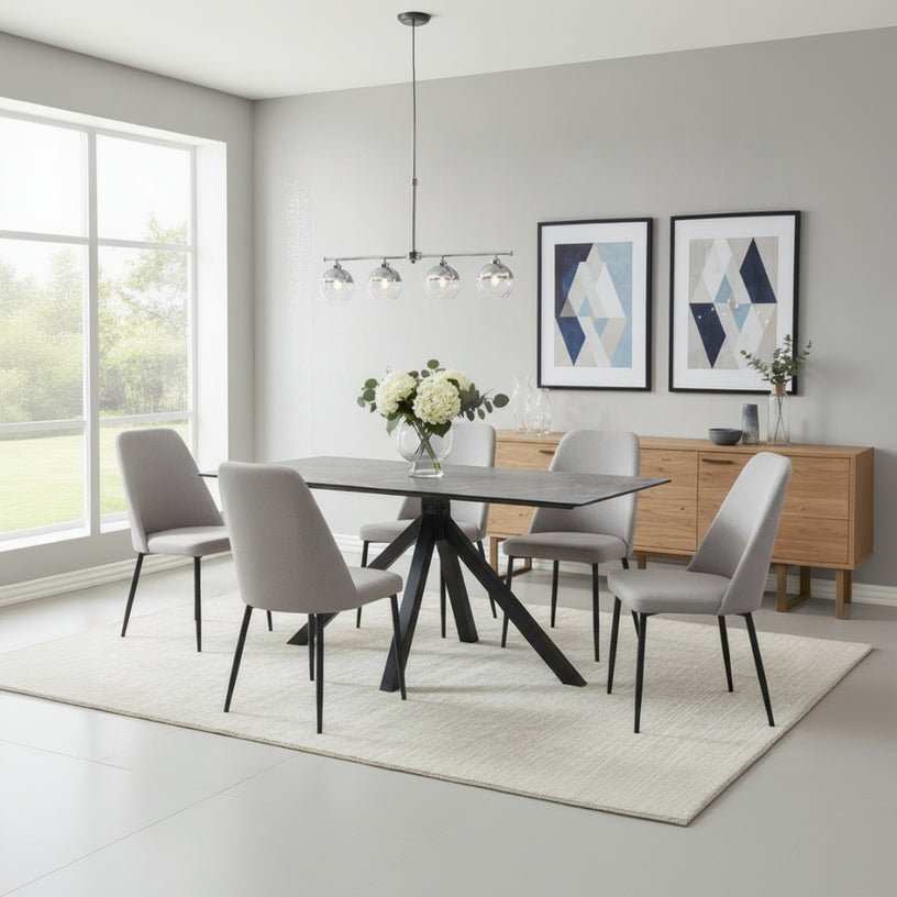 Carlton Furniture Rhodes Fixed Rectangular, Grey Ceramic-Effect Glass Top Table, with an angular black metal base. Can seat 4 people comfortably
