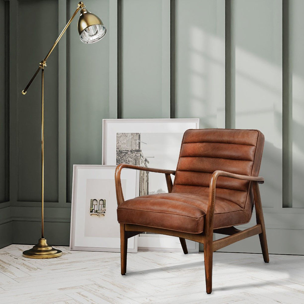 Carlton Furniture Ribble Accent Chair features a sculpted wooden retro inspired frame, with a brown leather cushioned seat and backrest 
