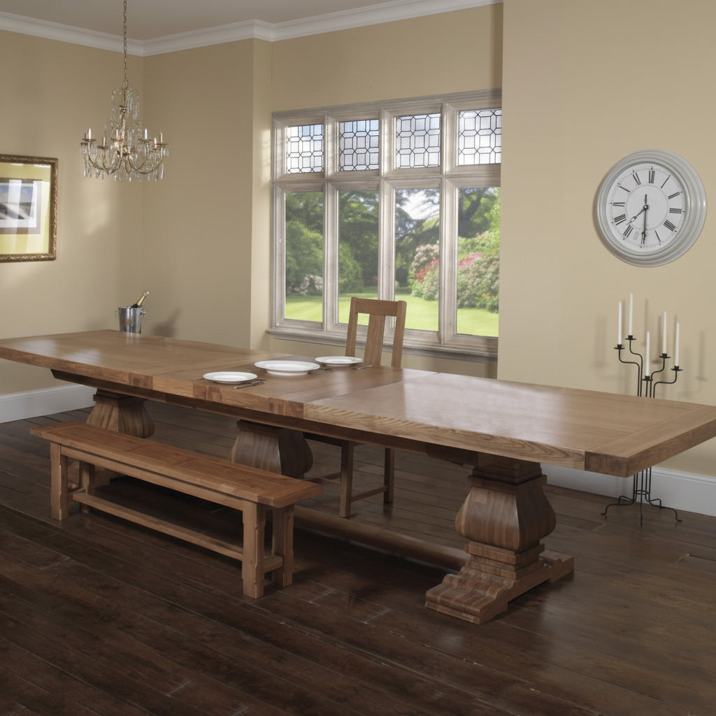 Carlton Furniture Windermere Grand Ark Royal Monastery Table in Natural solid oak wood with a thick plank extending table top and 3 pedestal legs to create a large dining table for up to 20 people 