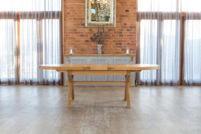 Carlton Furniture Windermere Oval Extending Dining Table made from solid natural oak, with cross leg base, can seat 8-12 when fully extended