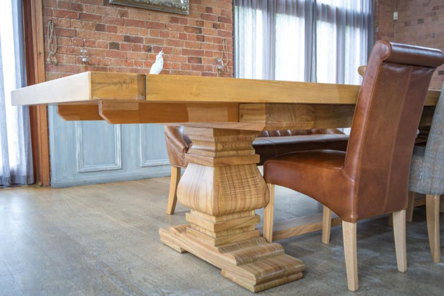 Carlton Furniture Windermere Rustic Monastery Extending Dining Table in Natural Solid Oak with baluster style pedestal legs and a rustic planked table top