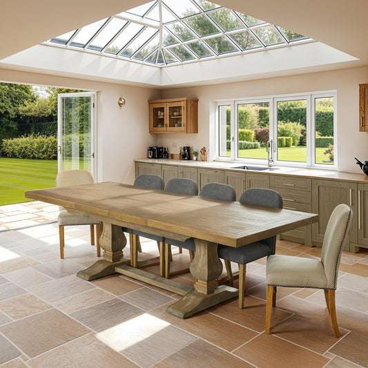 Carlton Furniture Windermere Small Monastery Extending Oak Dining Table in a Natural Finish, with turned pedestal legs, can be extended from 180cm to 280cm to seat between 8-12 people