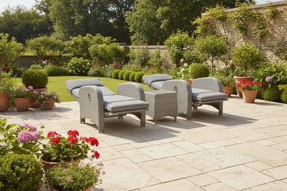 Chelsea Bermuda 3 Piece Lounge Set in Grey Weave rattan features 2 reclining lounge chairs with grey padded cushions and a small side table