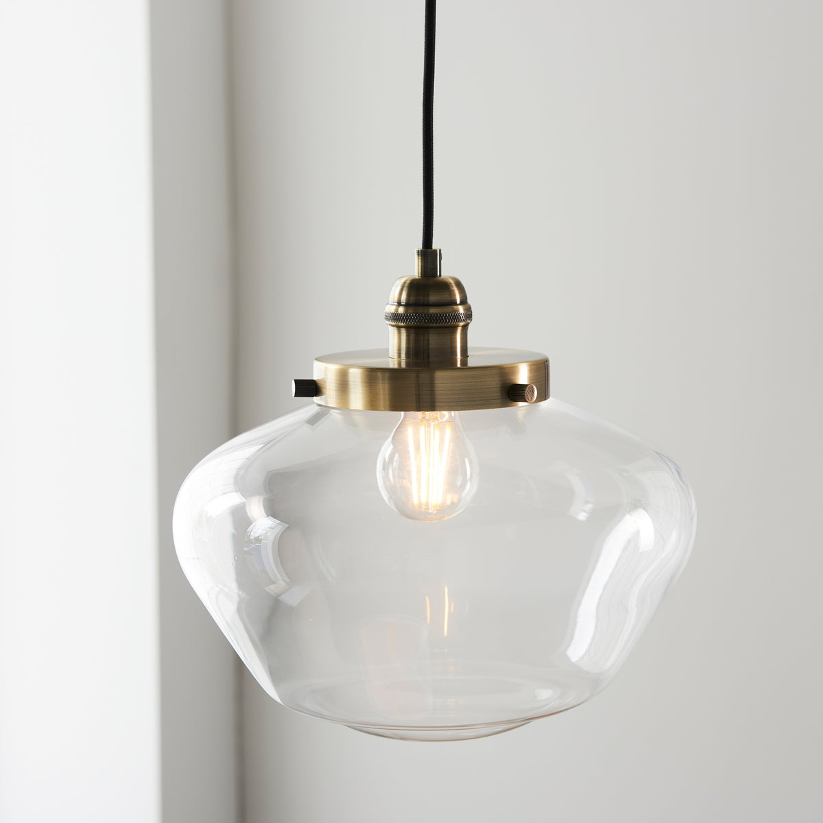 Gallery Direct Lindby Pendant Light Brass / Clear, styled in a room setting